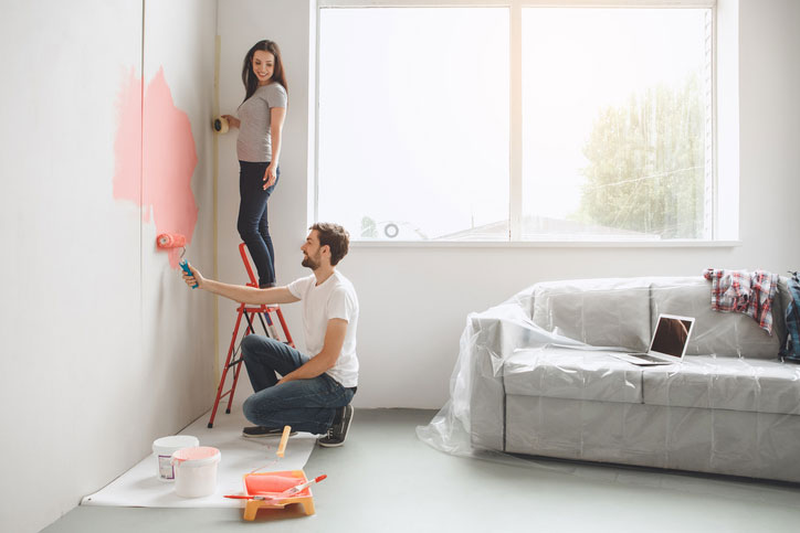 Young couple doing apartment repair together themselves